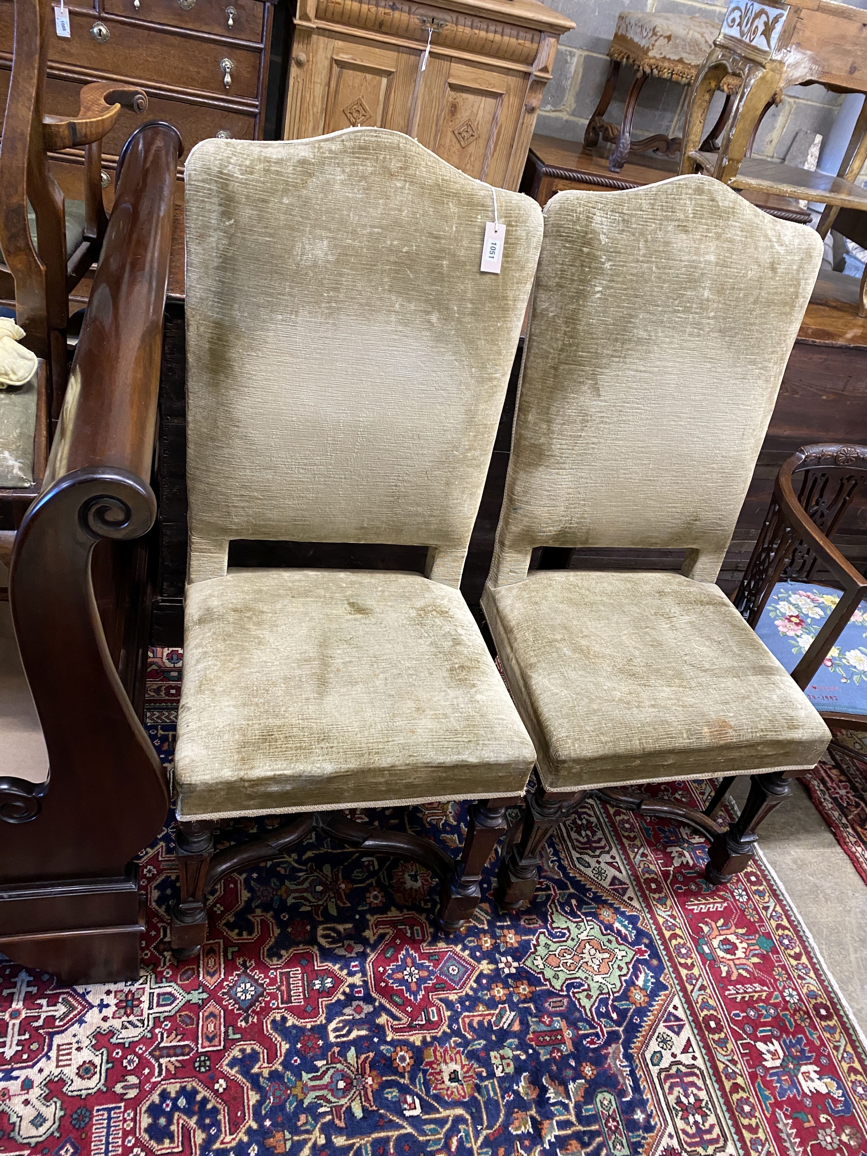 A pair of 17th century high back upholstered chairs (restorations), width 53cm, depth 46cm, height 121cm